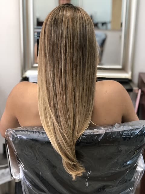 A modern, stylish haircut with clean lines and expertly crafted layers, showcasing a fresh and contemporary look.