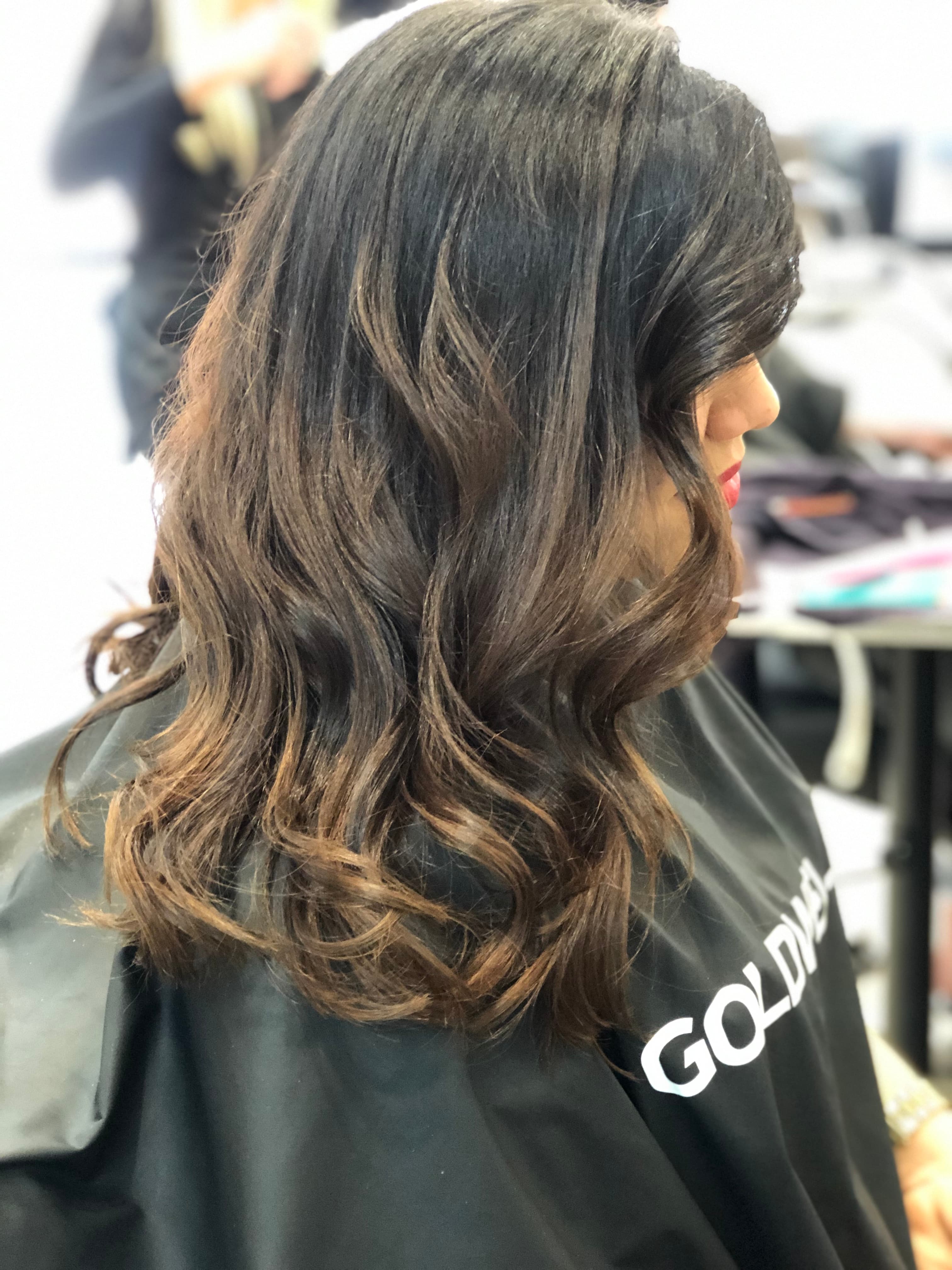 A modern, stylish haircut with clean lines and expertly crafted layers, showcasing a fresh and contemporary look.